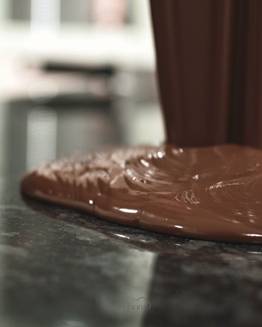 Tempered by hand until every bar breaks with a clean snap.